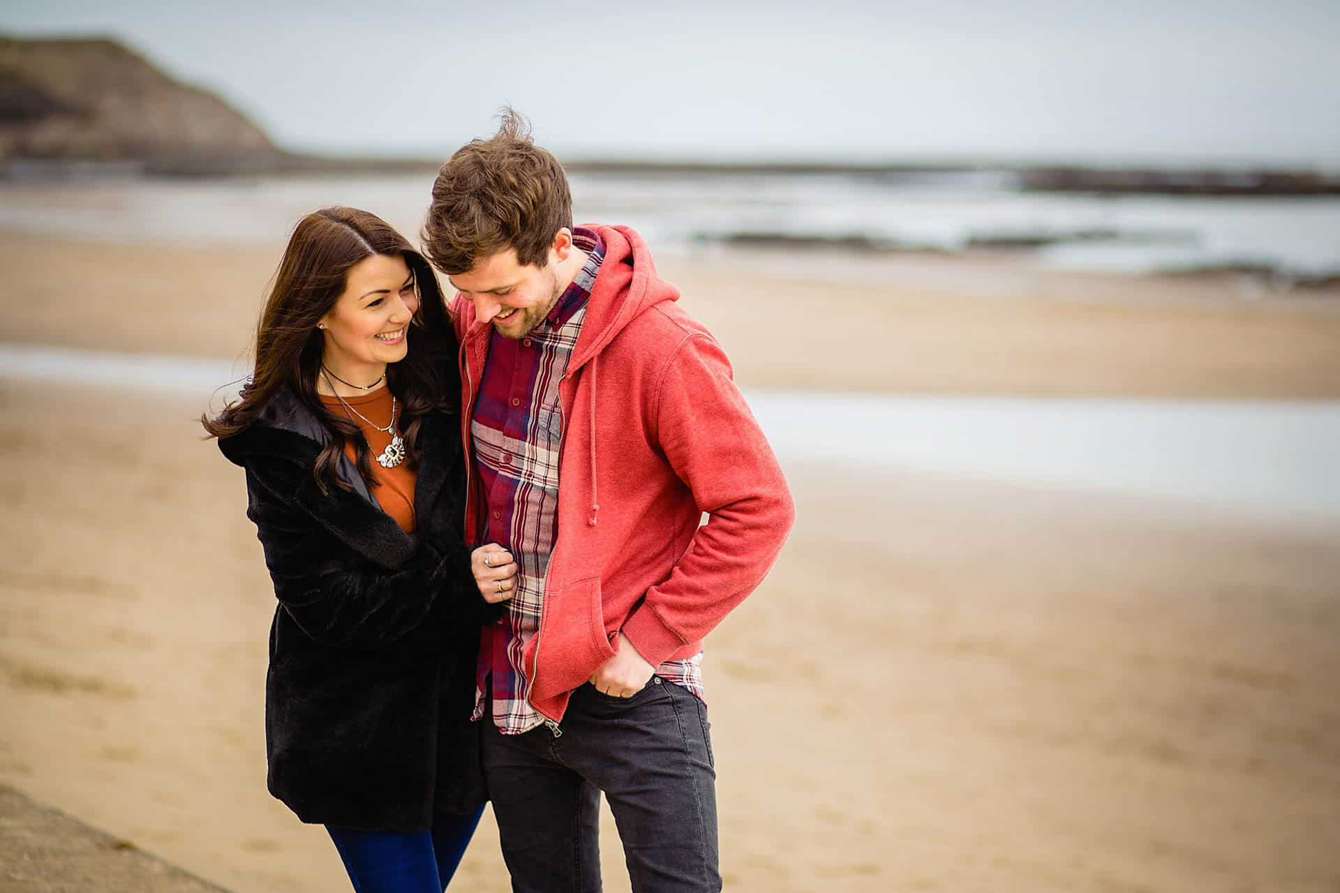 a newly engaged couple on scarborough beach, scarborough engagement photography by emma and rich