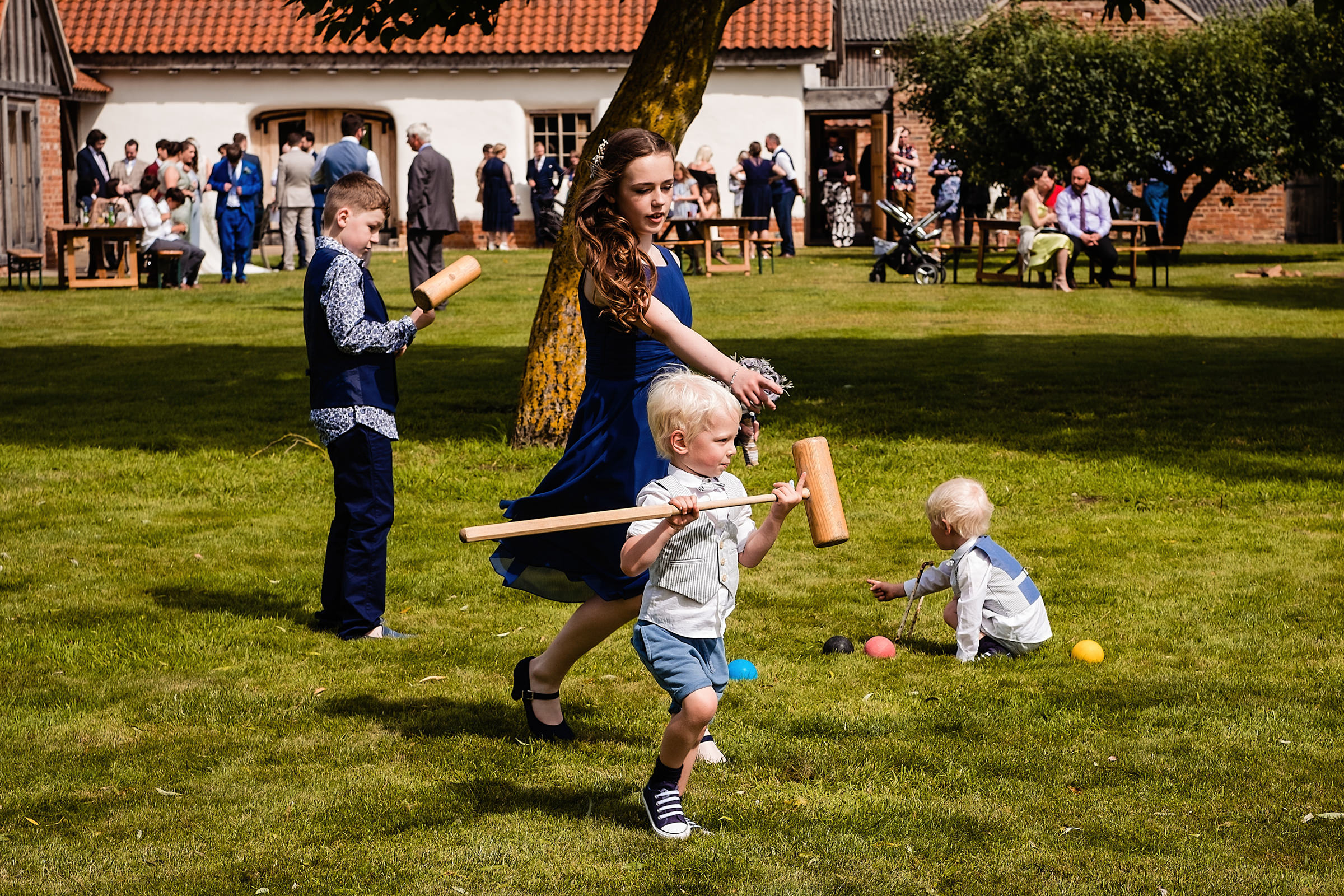 Children playing in the gardens at Abbey Farm Weddings.