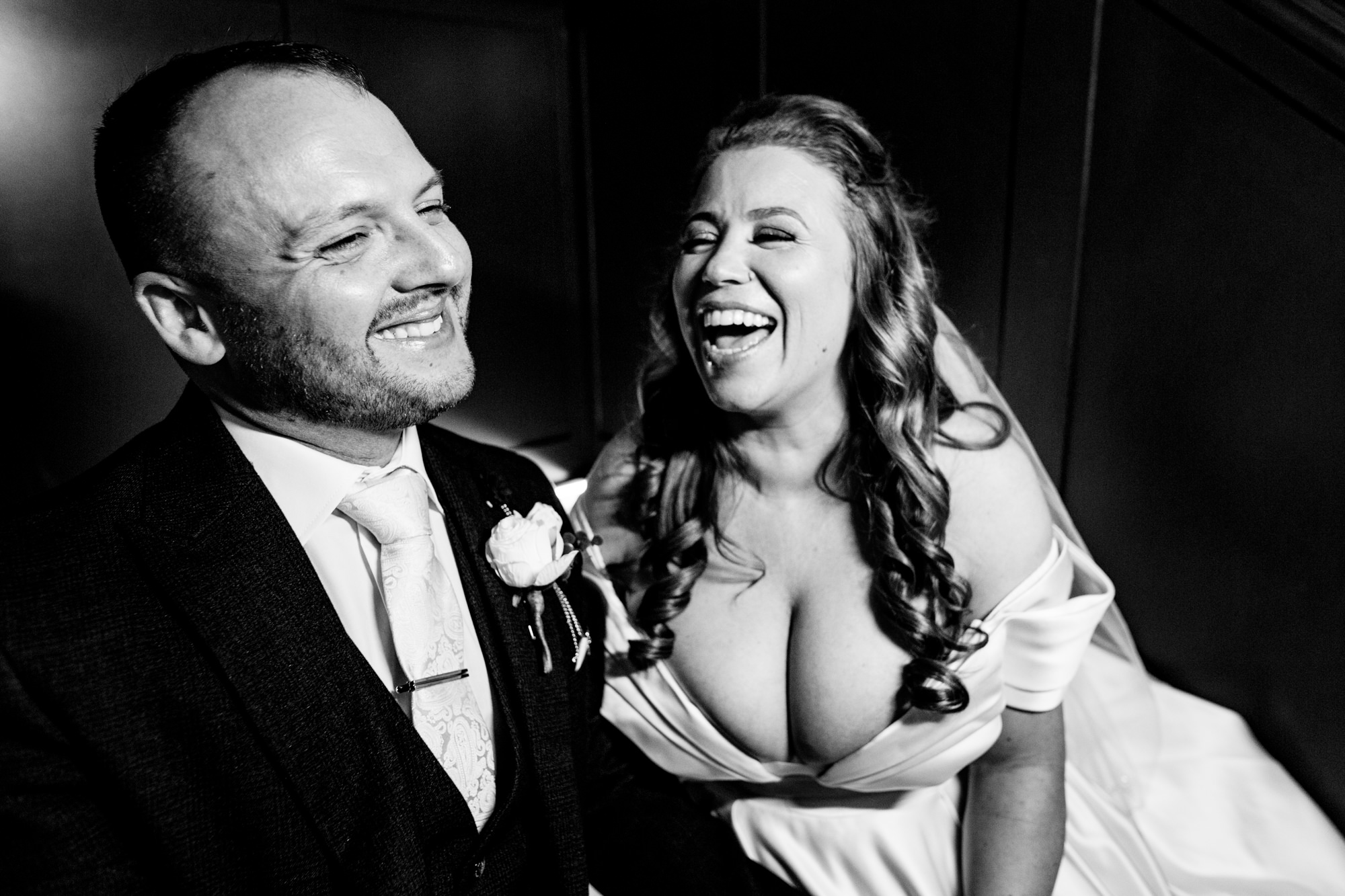 newlywed couple laughing on their wedding day - parr's bank hotel wedding photography by emma and rich